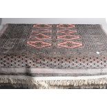 A seconh half 20th century woollen carpet, in pink, grey and black, 180cm by 120cm, some staining