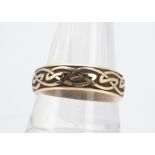 A 9ct gold Celtic wedding band, with knot design, ring size N, 6.5mm wide, 5.7g