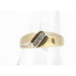 A diamond 14ct gold gentleman's dress ring, the three princess cuts in channel setting, ring size U,