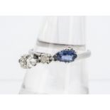 An unusual sapphire and diamond dress ring, the three stones comprising a diamond and sapphire