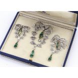 A set of three diamond and emerald drop evening brooches, the diamond set festoons and floral