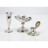 An Art Deco period silver filled capstan inkwell, together with a similar period bud vase and a