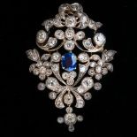 A 19th Century sapphire and diamond brooch or pendant, of pierced openwork floral design, centred