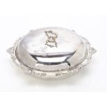 An Edwardian silver muffin dish by Goldsmiths & Silversmiths, London 1906, with engraved family