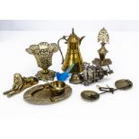 A group of vintage Middle Eastern brass items, including an oil lamp, four peacocks, a mortar and