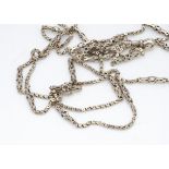 An 18th Century yellow metal fancy link muff chain, 61cm, unmarked, 18g