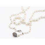 A cultured pearl and diamond clasp graduated necklace, the knotted string with largest pearl 7.