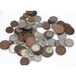 A small collection of loose British coinage, including a 1935 crown, some pre-1946 silver and