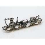 A 1970s silver miniature tea and coffee set, the dolls house style set comprising long tray,