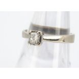 An 18ct white gold and diamond princess cut solitaire, in square cornered setting, ring size L,