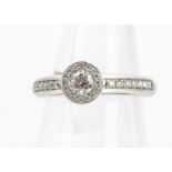 A Norwegian diamond dress ring, by Langaard with brilliant cut central diamond surrounded by a