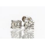 A pair of diamond studs, in white gold claw settings