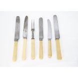 A collection of antique dinner and side knives, most with ivory handles, some with initials and