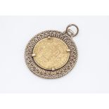 An Early Victorian gold full sovereign, in 9ct gold pendant mount, 11.2g, dated 1853 with Young head