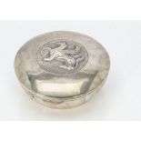 A Cypriot white metal circular box, marked 800, with griffin to lid, 8ozt and 13cm diameter