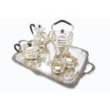 A good George V silver tea set and tray by HA, retailed by Spiridion & Son Cardiff, having feathered
