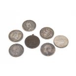 A collection of coins, including two early 19th Century crowns and three Victorian crowns, a 1922