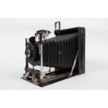 An Ernemann Heag Half-Plate Folding Camera, circa 1920, double extension, body G, Ibsor shutter