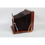 A Marion & Co Perfection 10 x 12in Mahogany Field Camera Body, square-cornered maroon bellows,