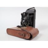 An Adams Vesta Roll Film Folding Camera, serial no 483, circa 1930, 6 x 9cm format, body G, wear