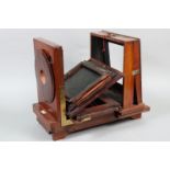 A Perken Son & Rayment Mahogany Studio Camera and Other Cameras, a large incomplete camera body, 8 x