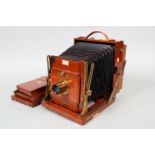 The 'Sanderson' Regular Half-Plate Mahogany Field Camera, serial no 20018, chamfered maroon bellows,