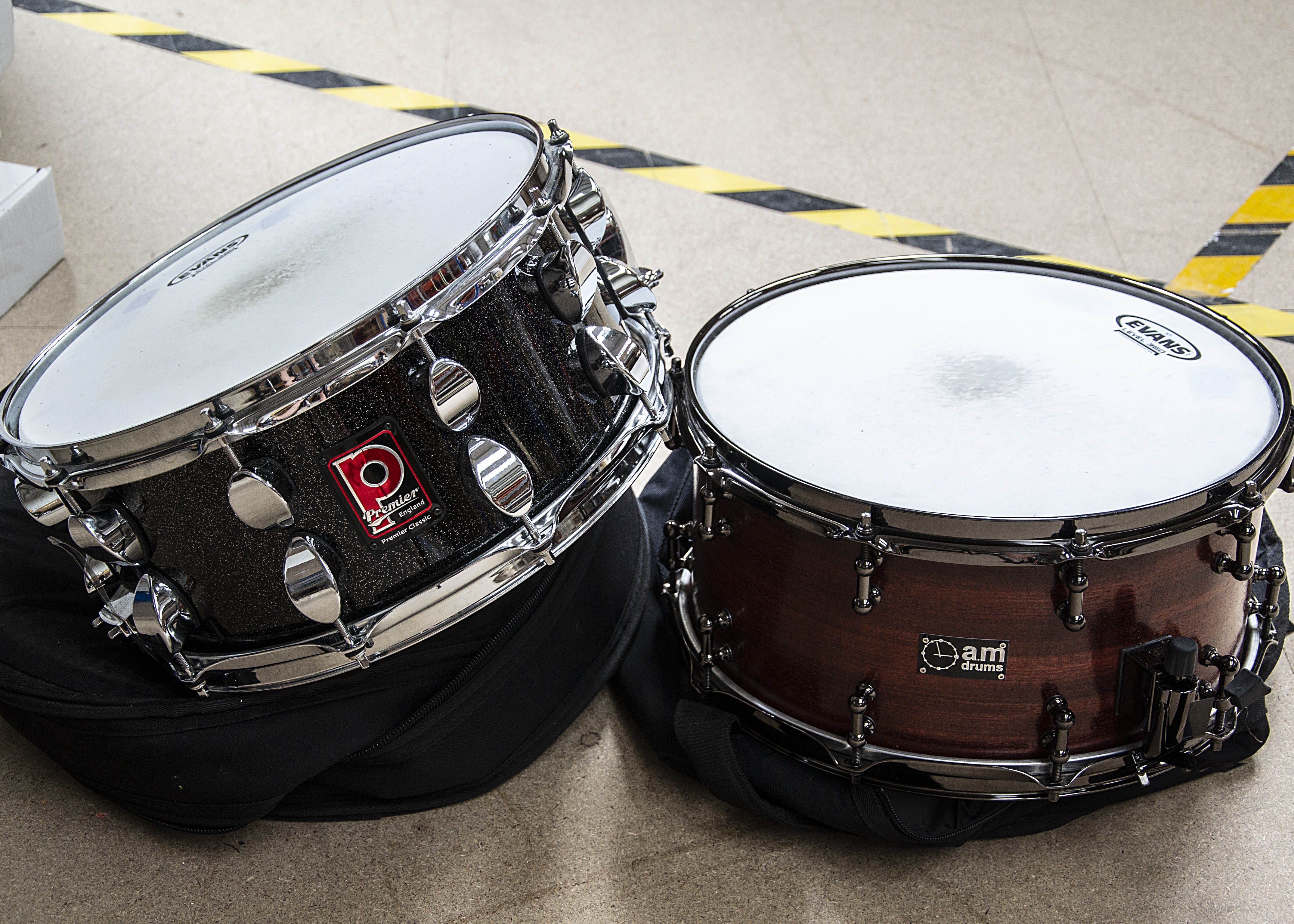 Snare Drums, two snare drums, a 14" Premier Classic (black with silver) and a 14" A&M snare (dark