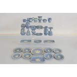 A collection of light blue Wedgwood Jasperware, including plates, bells, jugs, boxes, etc. Approx.