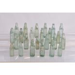 A collection of twenty four 19th century codd bottles, of various sizes and manufacturers and