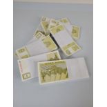 Eight bundles of Slovenian Tolar banknotes, contained in 100 notes stacks.