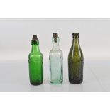 Two R. W. Wright & Sons Ltd bottles, with screw tops. 24cm tall in dark and light green. Together