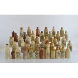 Forty Three stoneware ginger beer bottles, various sizes, mostly Birmingham and surrounding areas.