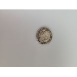 A William III silver shilling, clipped. 2.9g. 20mm diameter
