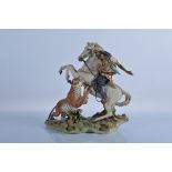 A large Capodimonte figure group, showing a Man on horseback hunting a Tiger, signed to base. 34cm