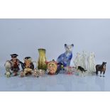 A collection of English ceramics, including Beswick Birds and Animals, a large Arthur Wood blue