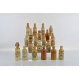 A collection of twenty stoneware 19th century Ginger Beer bottles, various makers including M. A.