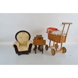 A quantity of dolls' prams and furniture, including cots, prams, chair and beds, etc