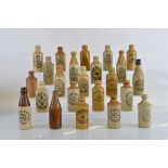 A collection of twenty three Wolverhampton stoneware ginger beer bottles, from J. Cotterill,