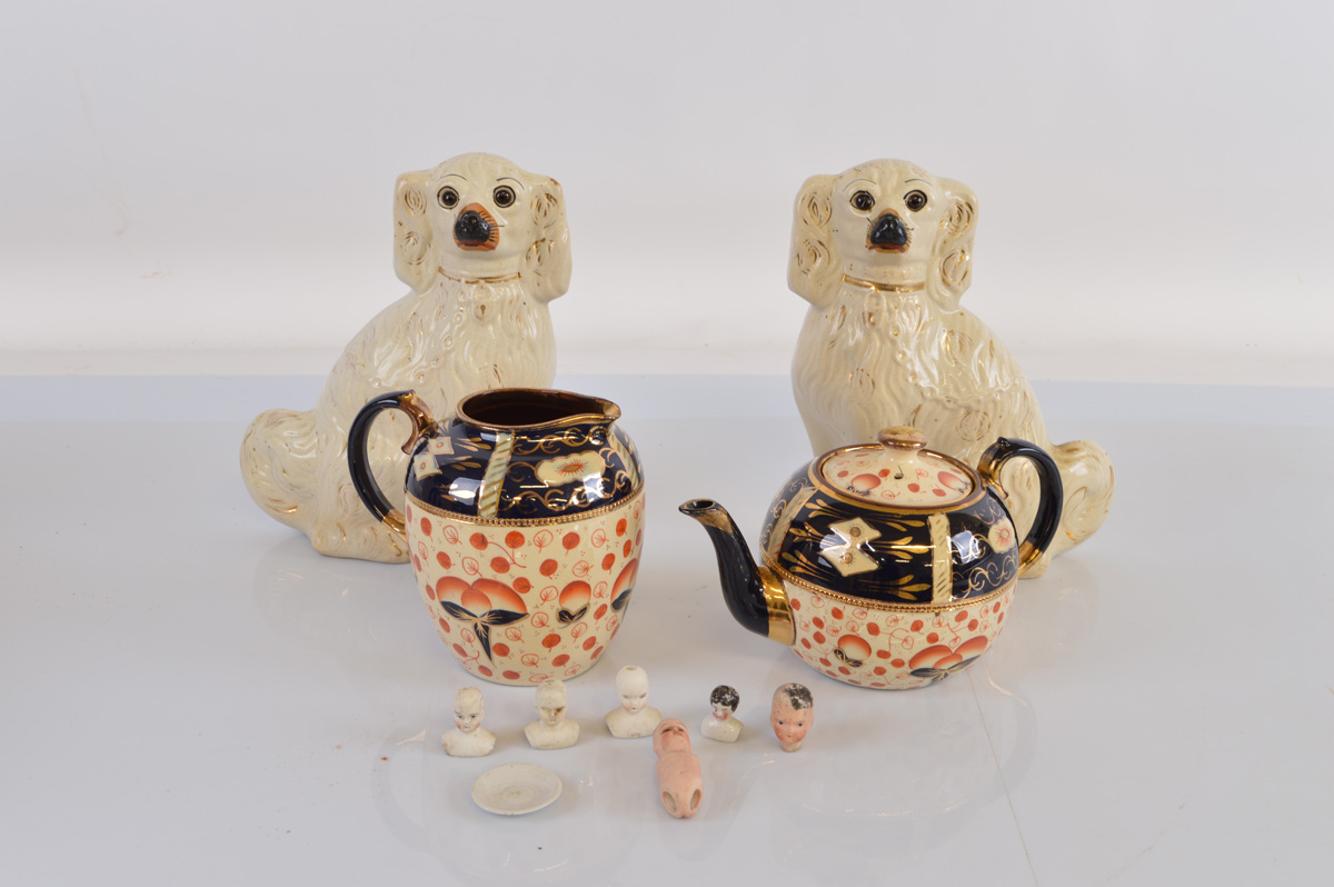 A pair of 19th century Staffordshire dogs, with moulded coats and glass eyes 25cm tall. Together