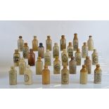 Twenty Six stoneware ginger beer bottles, mostly Birmingham, some with coloured tops, from Kyte's,