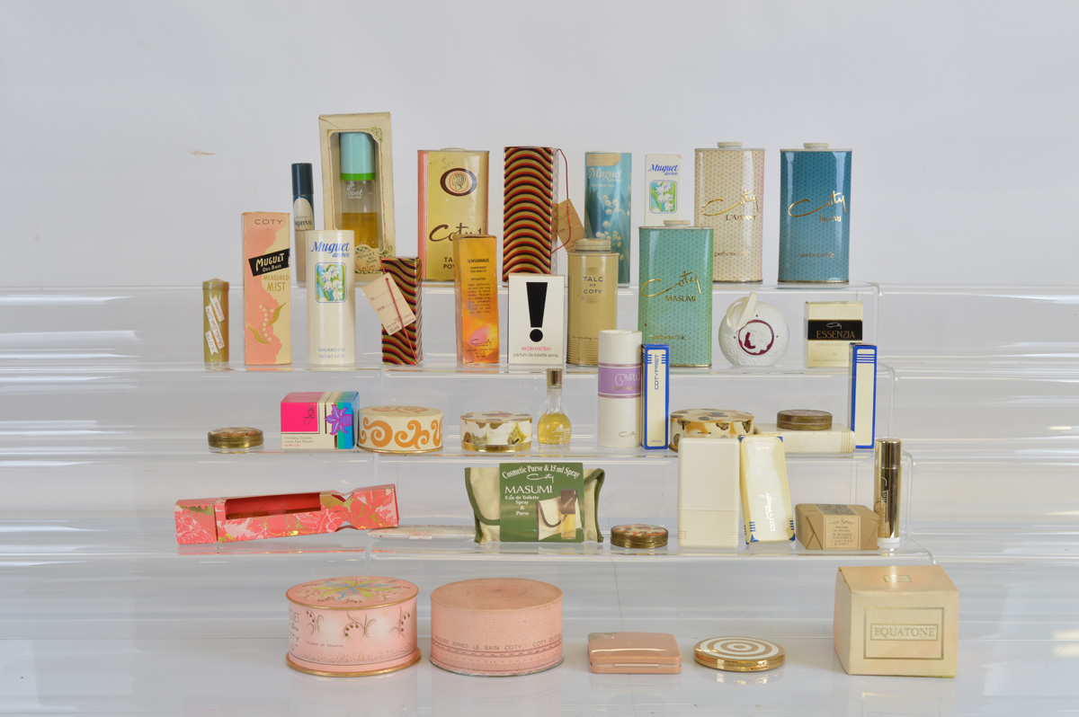 A collection of assorted Coty mid 20th century grooming products, including talc, perfume,