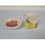 A Moorcroft "Magnolia" dish, 11.5cm diameter. Together with a Moorcroft lemon pattern mug (2)