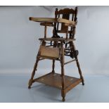 An Edwardian stained beech metamorphic child's high chair, with printed back splat of a