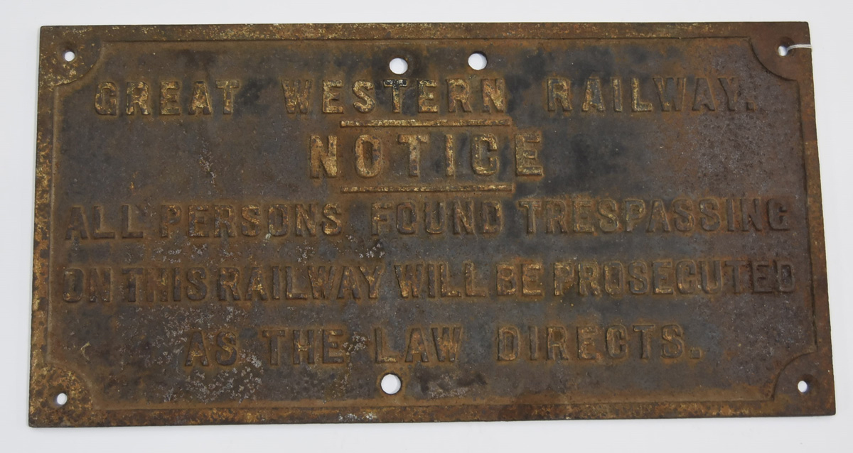 A GWR Cast-Iron 'Trespassers' warning notice, approx. 24" x 12", warning potential trespassers