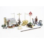 Lead farm accessories and figures by various makers comprising Britains see-saw with boy and girl,