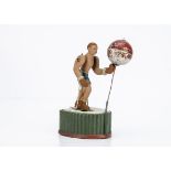 A Jouet Création Clockwork Boxer Toy, circa 1949, clay and cement construction, boxer in blue trunks