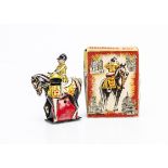 A Wells Brimtoy Tinplate Clockwork Drummer Boy, detailed tinprinted drummer on horseback, in