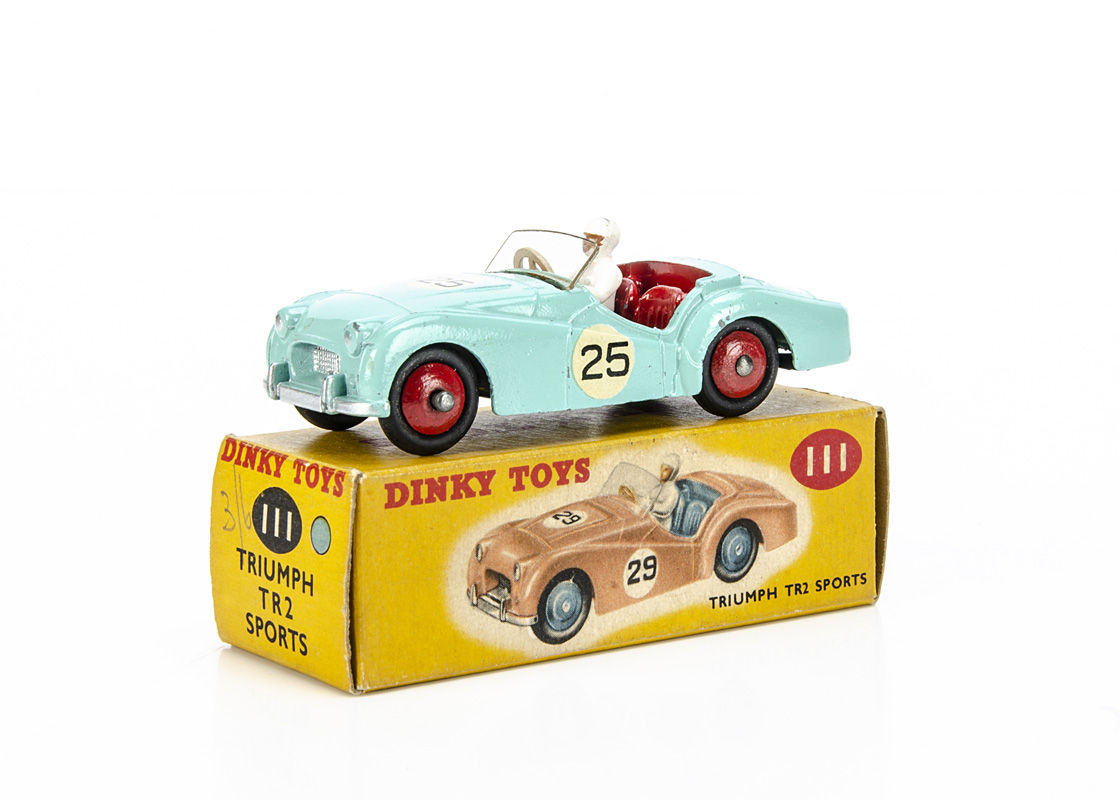 A Dinky Toys 111 Triumph TR2 Sports (Competition Finish), turquoise body, red interior and hubs,