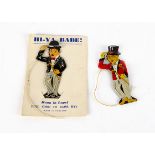 Two Tinplate Lapel 'Greeter' Novelty Toys, one of Charlie Chaplin on original backing card, 'Made in