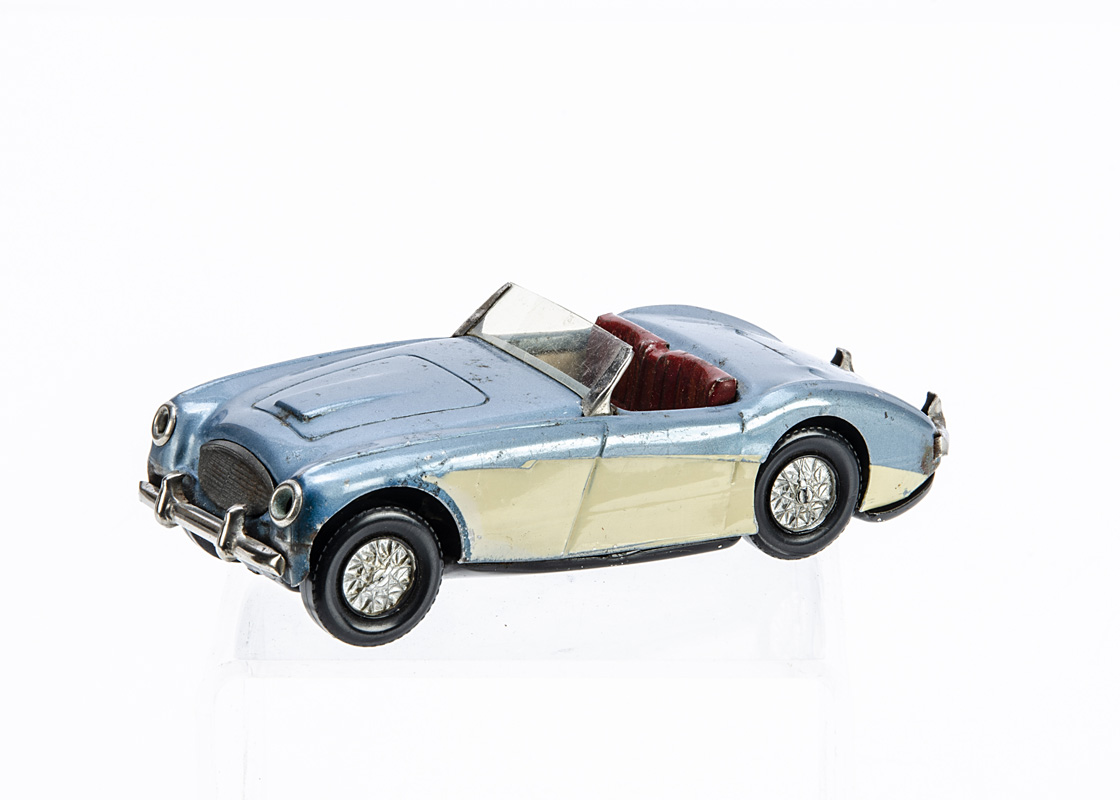 A Scalextric Electric Tinplate MM/C53 Austin Healey 100/6, metallic blue body, cream side panels,